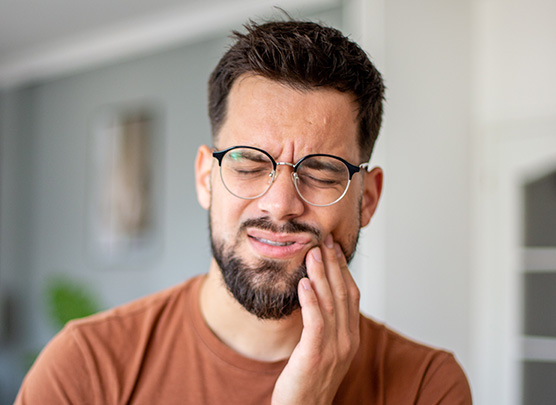 Man suffering from tooth pain