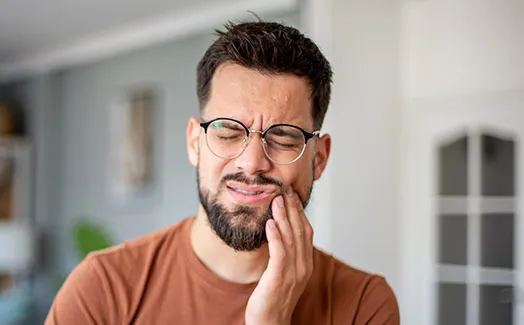 Man suffering from tooth pain